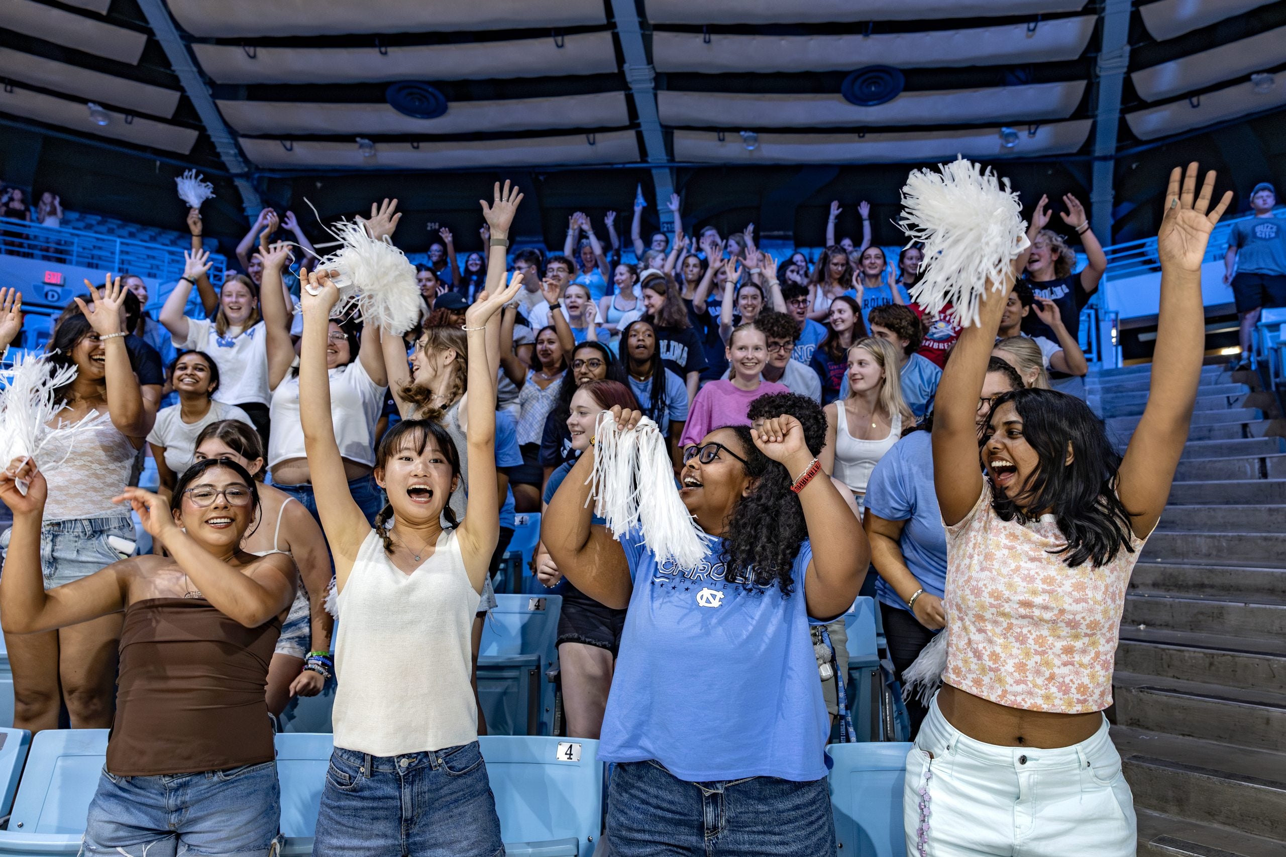 Students learn cheers during a pep rally at Carmichael Arena during Weeks of Welcome.