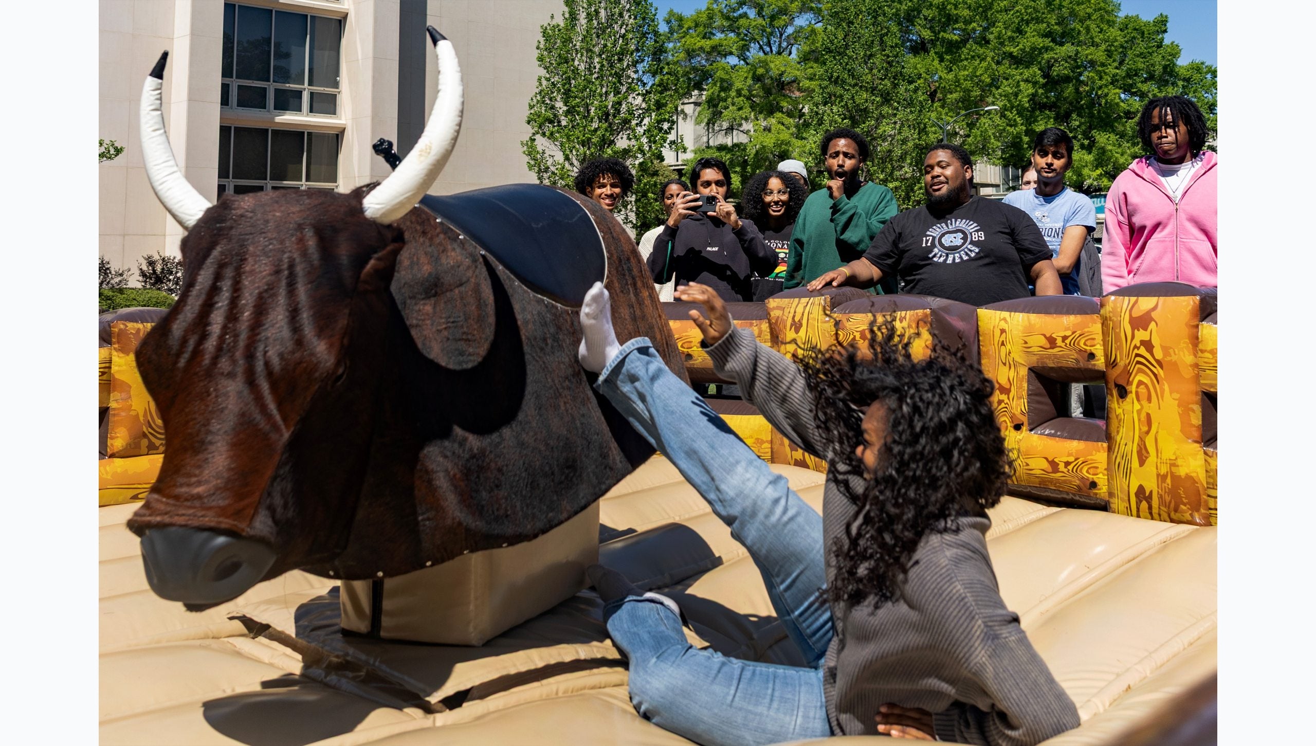 UNC-Chapel Hill falling off a mechanical bull.