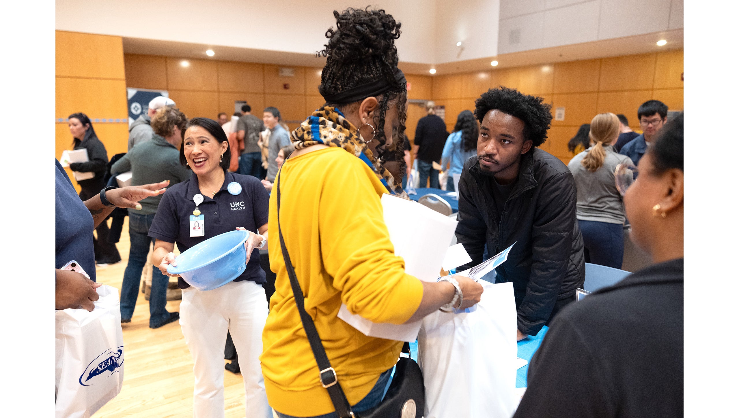 A UNC-Chapel Hill employee speaking to a man.