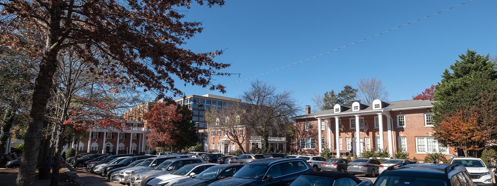 Fraternity Court on the campus of UNC-Chapel Hill featured several frat houses on a sunny day.