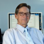 Close-up portrait of Jim White in his office.