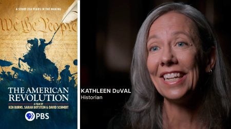 Kathleen DuVal next to a poster of the PBS American Revolution series.