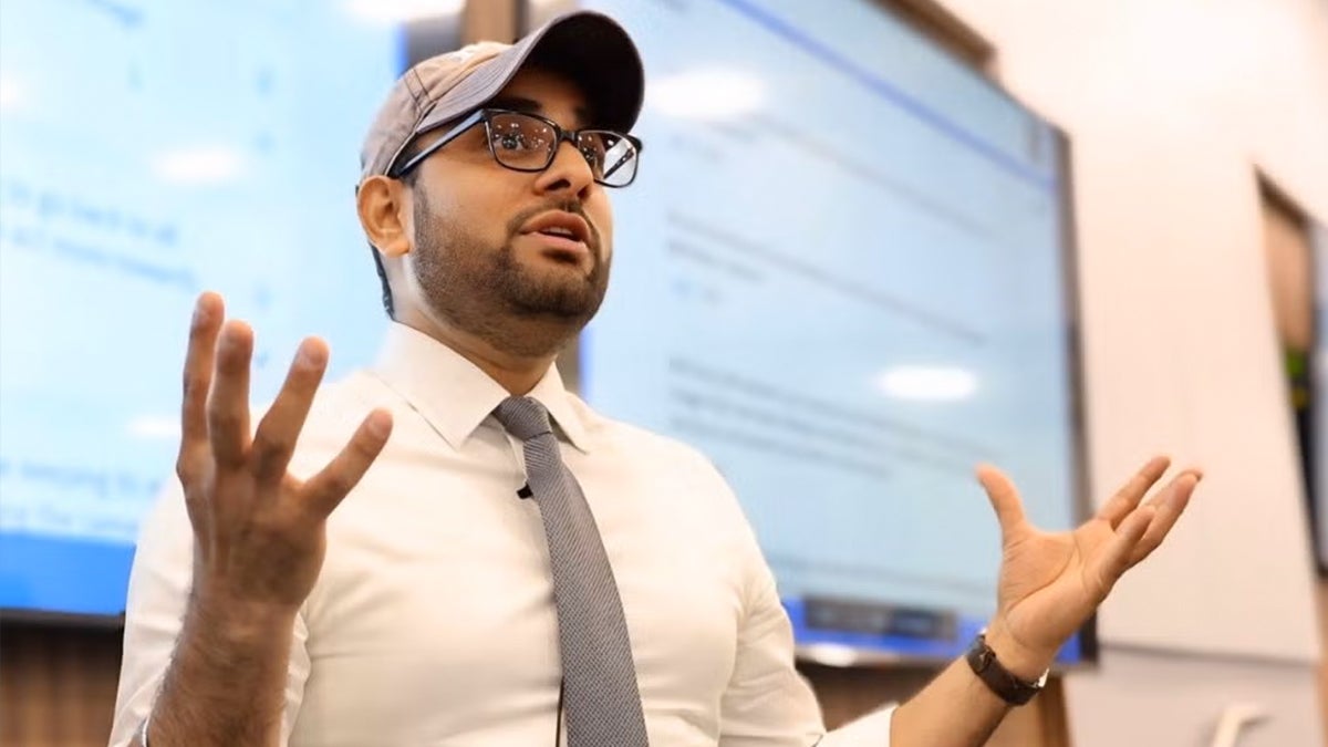 Close-up image of professor Neil Gakwad lecturing to a class.