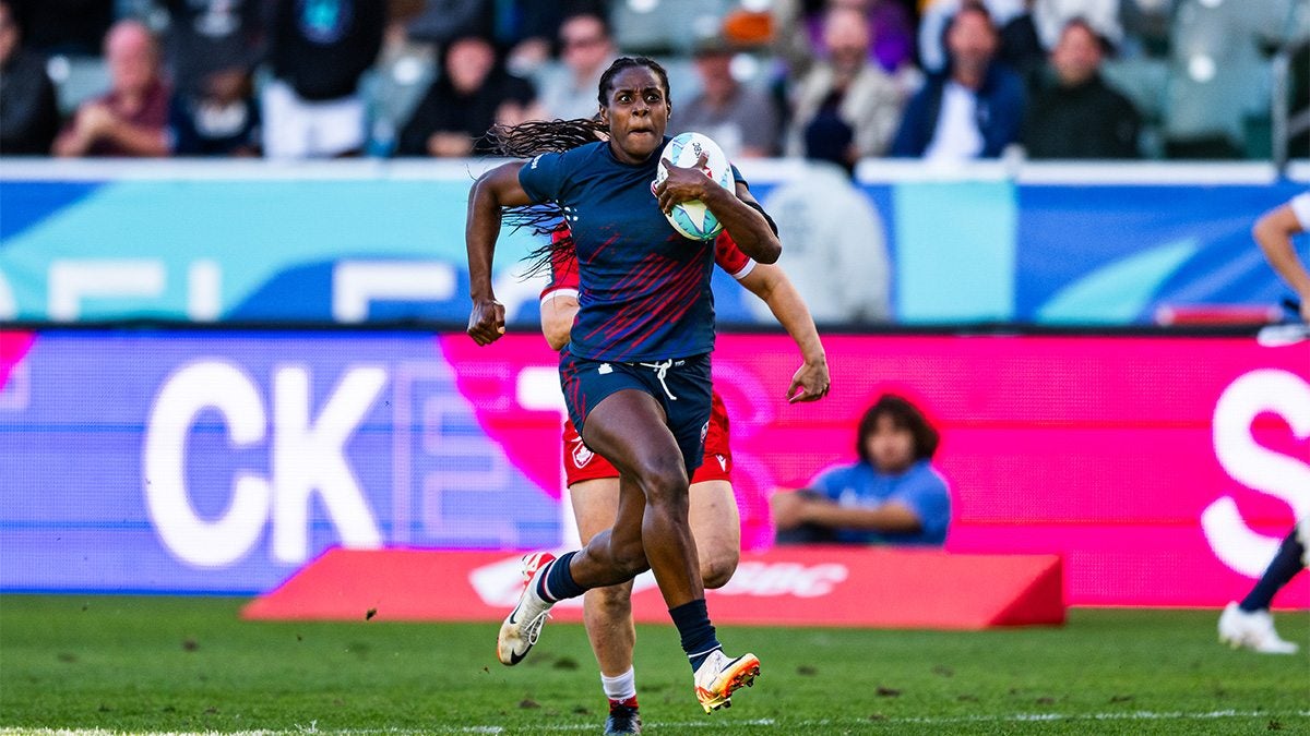 Naya Tapper running on the rugby field.