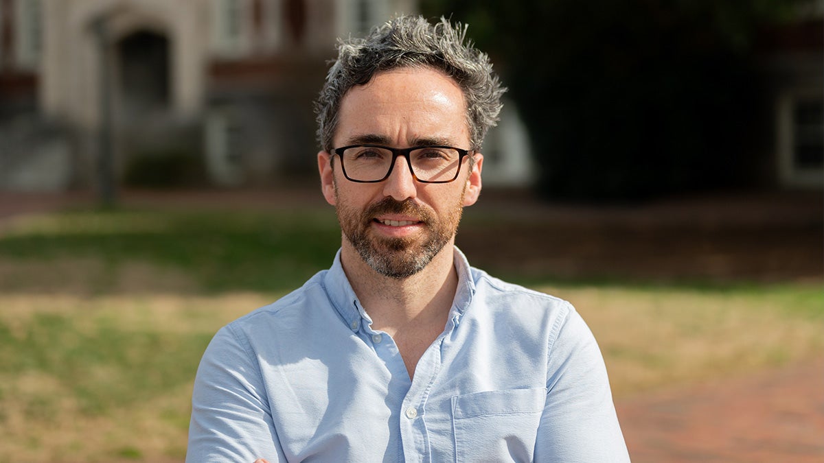 A portrait photo of Pedro Saenz on U.N.C. campus.
