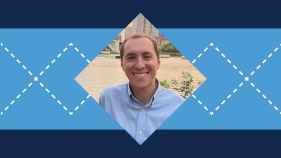 Argyle patterned graphic with Carolina Blue and Navy blue colors with a picture of Andy Boyle in the middle.