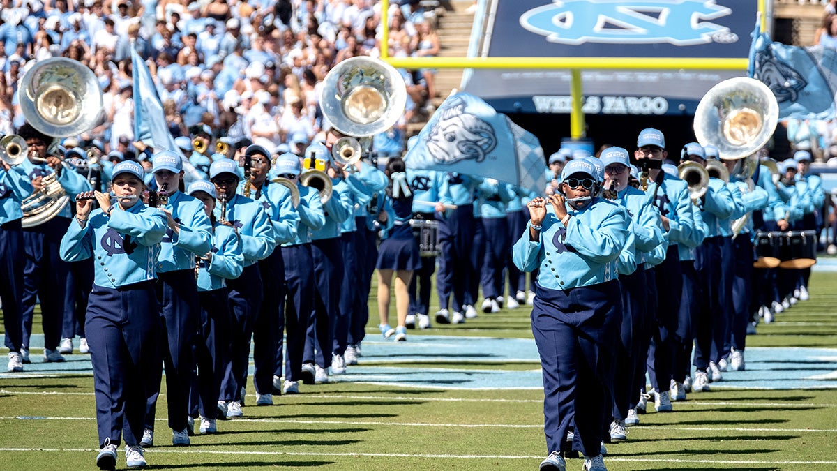 The Carolina marching band performs on the field at Kenan Stadium before the Tar Heels' game against Clemson.