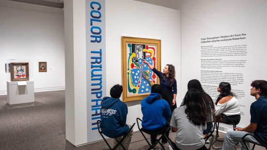Elizabeth Manekin showing a piece to Robertson scholars.